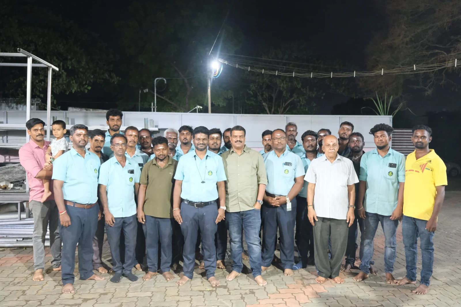 Group gathered outside a workshop for a photograph